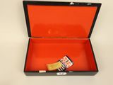 a small box with a toothbrush and a tube of toothpaste in it