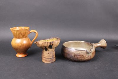 three different types of vases and bowls on the table