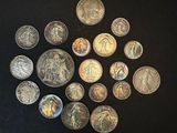 a lot of coins that are sitting on a table