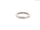 a close up of a diamond ring on a white background