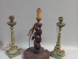 three candles that are sitting on a table