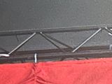 a picture of a stage with red curtains and lights