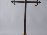 wooden cross on a stand on a gray background