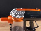 a toy gun that is sitting on a table