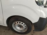 a picture of a white van parked in a garage