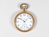 a gold pocket watch with a white face on a white surface