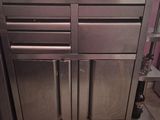 a stainless steel kitchen island with drawers and drawers on it