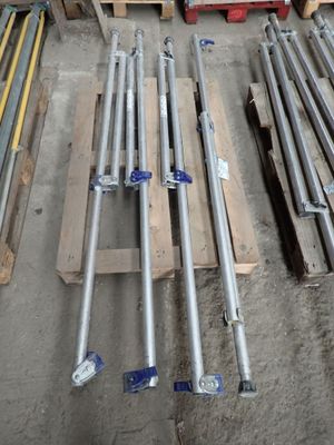many different types of pipes and poles in a warehouse