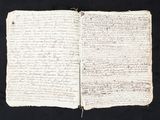a close up of an open book with writing on it