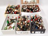 many bottles of alcohol in a box on the table