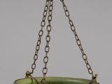 an image of a green glass bowl hanging from a chain