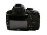 a digital camera that is sitting on a white surface
