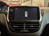 the dashboard of a car with a cell phone in the center of it