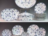 many plates and bowls with blue and white designs on them