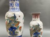 two vases sitting next to each other on a table