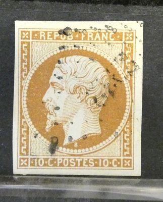 un vieux timbre sur lequel figure le visage d'un homme