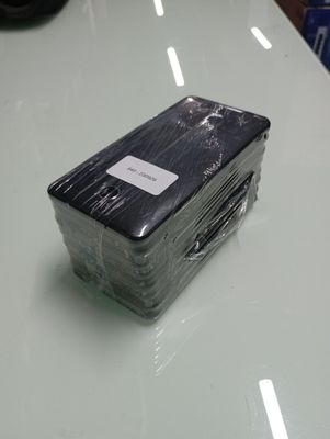 a plastic container on a table that has a label on it