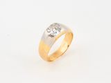 a gold and silver ring with a diamond