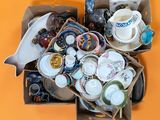 a box full of assorted items sitting on an orange surface