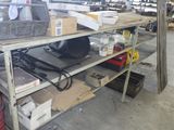 a metal shelf with a lot of items on it