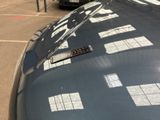 cars parked in a parking lot with a parking meter on the side of the road