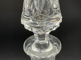 an image of a clear glass candle holder with a dome on top