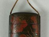 a small black case with red flowers on it