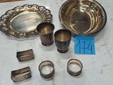 a table with a lot of silver items on it