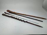 three different types of weapons are displayed on a white surface