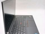 a laptop computer that is open on a white surface