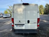 a white van that is parked in a parking lot