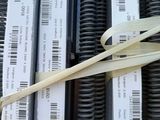 a pair of scissors that are sitting on top of a stack of coils