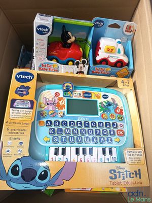 a toy keyboard in a box with other toys in it