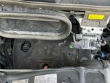 a picture of a car engine with its hood open