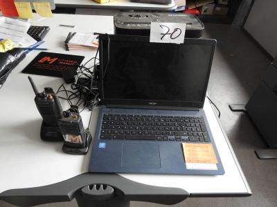 a laptop computer sitting on top of a desk