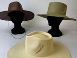 two hats on a mannequin head and a hat on a mannequin head