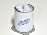 a can of paint on a white surface with a blue and red stripe
