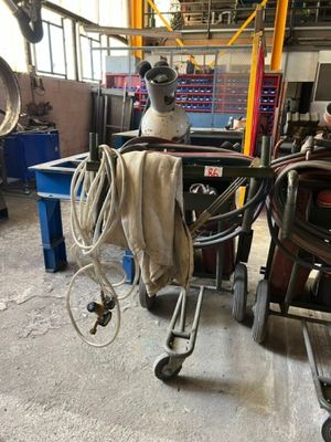 a man working on a machine in a factory