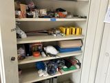 an image of a cupboard with many items in it