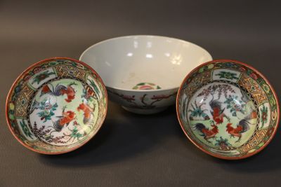 two bowls and a bowl with a design on them on a table