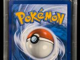 a close up of a card with a pokemon ball on it