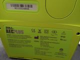 an image of a yellow aeg plus machine sitting on top of a table