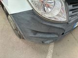 a close up of a car ' s headlight and front bumper