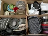 a box full of different types of dishes and pans
