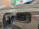 a close up of a car charging at a gas station