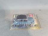 a blue toy car in a clear plastic box