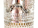 a silver cup that has a handle on it