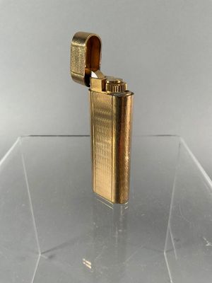 a lighter that is sitting on a clear table
