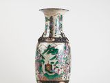 a vase that is sitting on a white surface