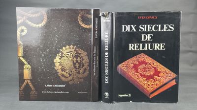 two books sitting on top of a table next to each other